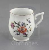 A Derby coffee cup, c.1758, of baluster shape with wishbone handle, painted in 'Cotton-stem painter'