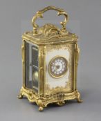 An early 20th century ormolu hour repeating carriage clock, in ornate Louis XVI style asymmetrical