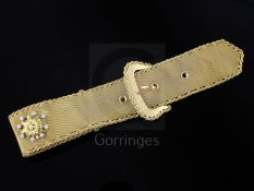 An Italian Brevettato 18ct gold and diamond set bracelet, modelled as a belt and buckle, the central