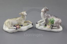 A matched pair of early Derby figures of a stag and hind, c.1756-8, each recumbent on a flower