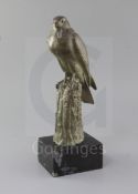 Irénée Rochard (1906-1984). A green patinated bronze model of a falcon perched upon a tree stump,