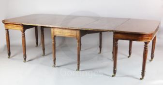 A Regency mahogany dining table, comprising central drop leaf and two D shaped ends, on turned