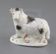 A rare Longton Hall figure of a ram, c.1752, standing on an oval base painted and applied with