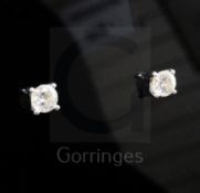 A pair of 18ct white gold and solitaire diamond ear studs. both stones measuring approximately 5.