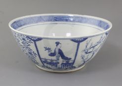 A large Chinese blue and white bowl, 19th century, painted with panels depicting a lady in a