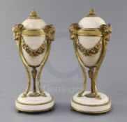 A pair of ormolu mounted white marble cassolets, with ram's head terminals, height 11in.