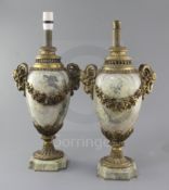 A pair of late 19th century French ormolu and marble lamp bases, decorated with goat's heads and