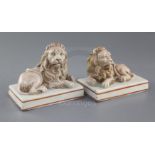 A pair of Wood & Caldwell pearlware models of recumbent lions, c.1800, each figure with a