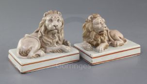 A pair of Wood & Caldwell pearlware models of recumbent lions, c.1800, each figure with a