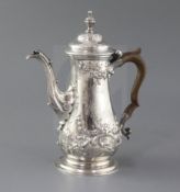 An early George III silver coffee pot by John Payne?, of baluster form, with engraved crest and