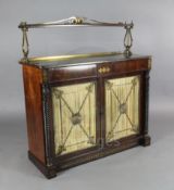 A Regency brass inset rosewood chiffonier, with single raised shelf supported by cast ormolu lyre