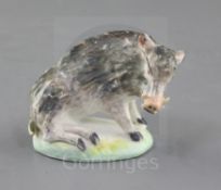 A rare Derby small figure of a seated wild boar, c.1760, on an oblong base, pad marks, h. 6.3cm,