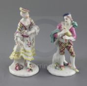 A pair of early Derby figures of a bagpiper and female companion, c.1756-7, each wearing tartan