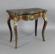 A mid 19th century French red boullework card table, with serpentine top and ormolu mounted cabriole