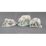 Three Derby figures of ewes, c. 1760-5, two of the figures standing and bowing to eat grass on