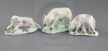 Three Derby figures of ewes, c. 1760-5, two of the figures standing and bowing to eat grass on