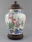 A Chinese wucai baluster jar, Transitional period, 17th century, painted with dignitaries and