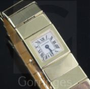 A lady's 18ct gold Cartier quartz bracelet watch, with signed square Roman dial and case back