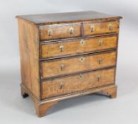 An early 18th century crossbanded burr walnut and mulberry chest, of two short and three graduated