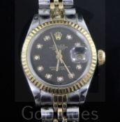 A lady's steel and gold Rolex Oyster Perpetual Datejust wrist watch, with black dial and diamond dot