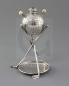 A late Victorian novelty silver and ivory mounted table club lighter, modelled as a golf ball