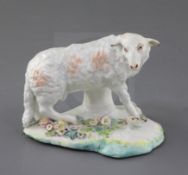 An early Derby 'Pale family' figure of a ewe, c.1756, standing on a flower encrusted mound base