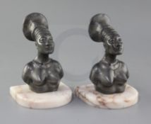 A pair of bronzed metal and onyx bookends of Mangbetu Tribe women from the Belgian Congo,