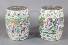 A pair of Chinese famille rose barrel shaped garden seats, c.1830-50, each painted with figures of