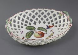 A large Derby oval basket, c.1760-5, the interior painted with an apple sprig, moths and other