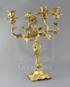 An early Victorian ormolu four light candelabrum, decorated with flowers and scrolls, height 20.