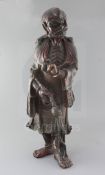 A large Chinese lacquered wood figure of a luohan, 17th/18th century holding a pearl and a fly