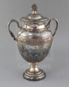 A George IV silver two handled presentation pedestal trophy cup and cover by Benjamin Smith III,