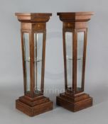 A pair of Edwardian marquetry inlaid rosewood display pedestals, with bevelled glazed sides, W.1ft
