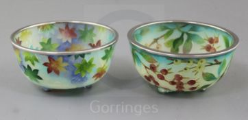 Two Japanese plique a jour enamel bowls, the first decorated with branches laden with berries and