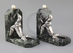 Maurice Frecourt. A pair of Art Deco silvered spelter, marble and ivory bookends, modelled as sea