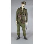 A WWI Royal Field Artillery officer's dress uniform and accessories, on a mannequin, of the type