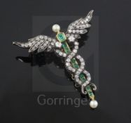 An Edwardian gold, emerald and diamond caduceus pendant brooch, with pearl-set terminals and