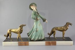 George Maxim (1895-1940). A French Art Deco painted and gilt spelter group of an elegant lady and