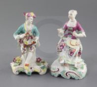 Two Derby 'Pale Family' seated figures of a gentleman and a lady, c.1756-8, holding a basket of