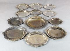 A set of twelve 19th century Sheffield plate shaped oval meat dishes, engraved with the Heneage