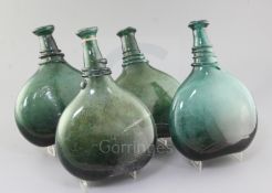 Four Persian green glass saddle flasks, 18th/19th century, each with a cable applied around the