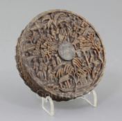 A Chinese export tortoiseshell circular box, c.1830-50, carved in high relief with figures amid