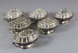 A set of six 19th century Sheffield plate entreé dishes, covers and handles and two handled heater