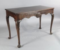 An Irish mahogany serving table, with scallop carved frieze and shell kneed cabriole legs with