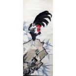 A Chinese scroll picture, manner of Xu Beihon, depicting a cockerel perched on a rock, the image