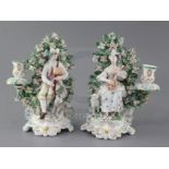 A pair of Derby candlestick groups of musicians, c.1770, the first a gentleman playing the