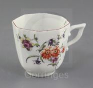 A Derby coffee cup, c.1758, of tapering hexagonal shape, painted in 'Cotton-stem painter' style with