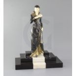 E.Menneville. A French Art Deco phenolic and bronzed spelter figure of a lady descending a