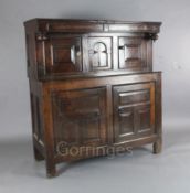 A mid 18th century oak diadarn, with four panelled doors, W.4ft 6in. D.1ft 9in. H.4ft 8in.