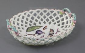 A Derby oval basket, c.1760-5, the interior painted with a cherry sprig and insects, lattice pierced